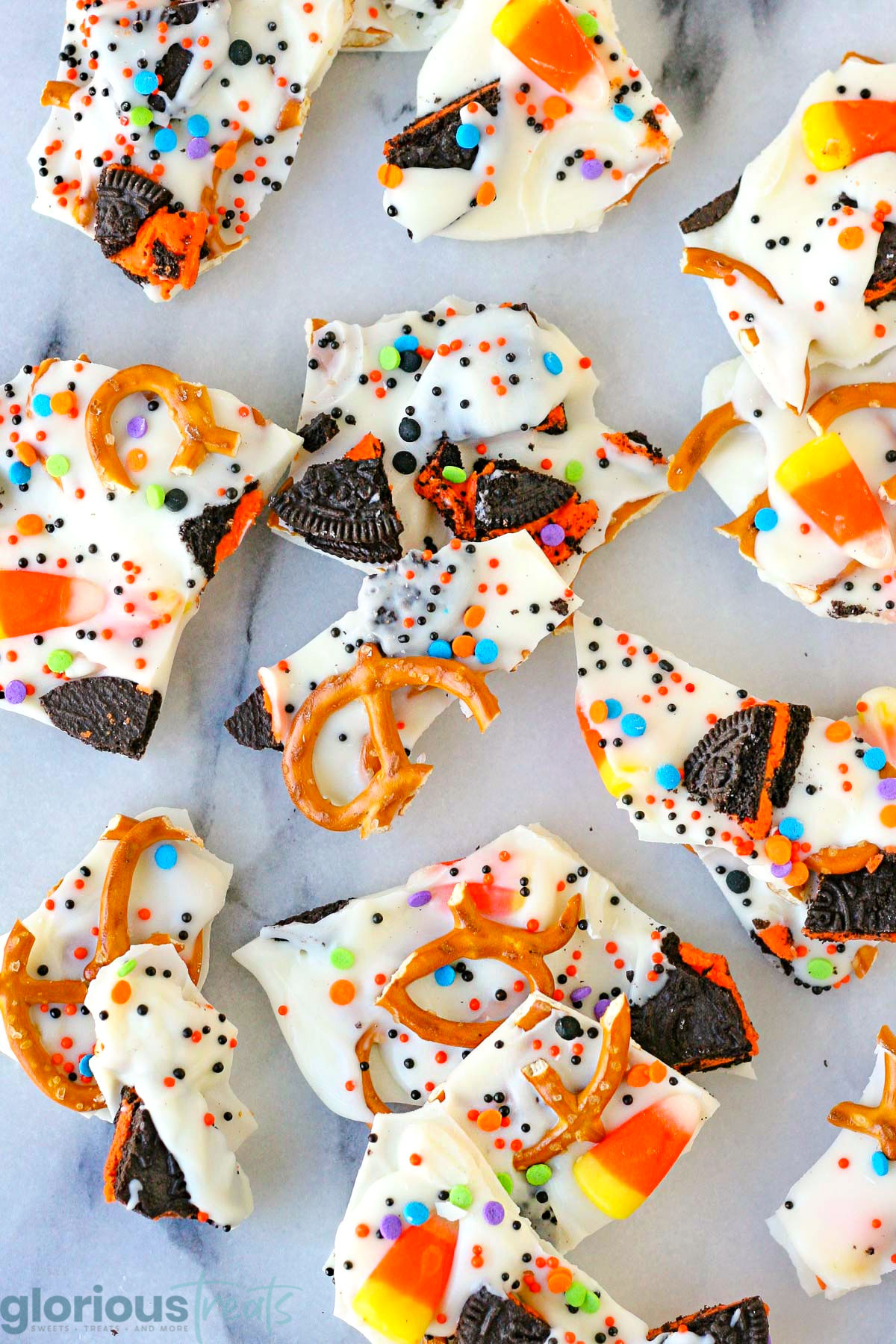 Top down look at halloween bark scattered on a white marble surface.