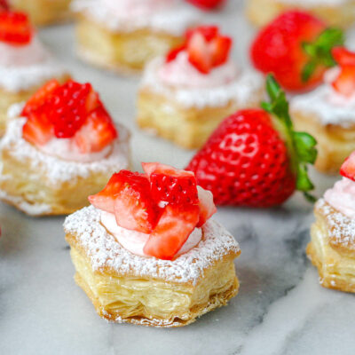 a few strawberry cream puffs topped with freshly diced strawberries