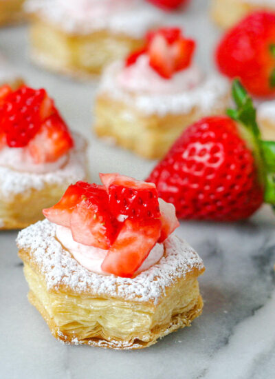 a few strawberry cream puffs topped with freshly diced strawberries