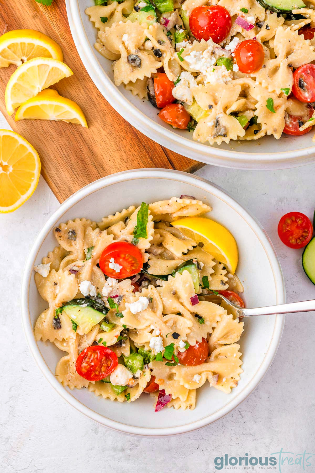 A white bowl of Greek Pasta Salad.