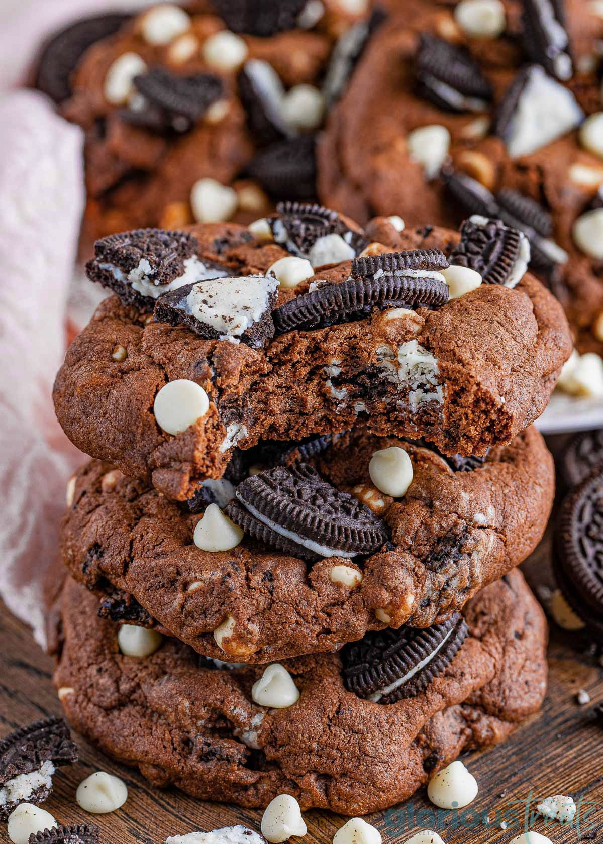 Cookies and Cream Cookies in a stack. The top one has a bite out of it.